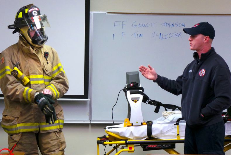 A firefighter talking to a class