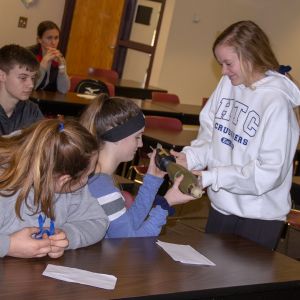 thumbnail image of Kids handing off something to each other