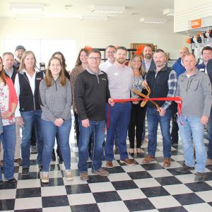thumbnail image of A group of ambassadors at a ribbon cutting