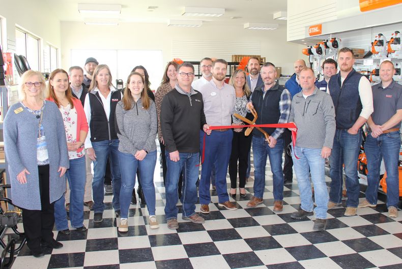 A group of ambassadors at a ribbon cutting