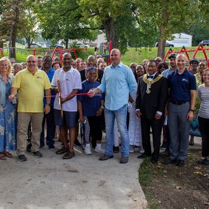thumbnail image of A group of ambassadors at a ribbon cutting