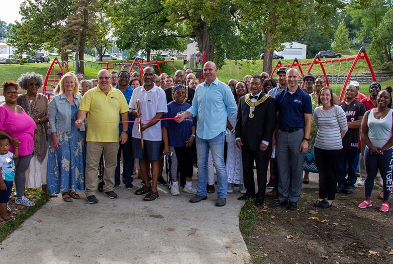 A group of ambassadors at a ribbon cutting