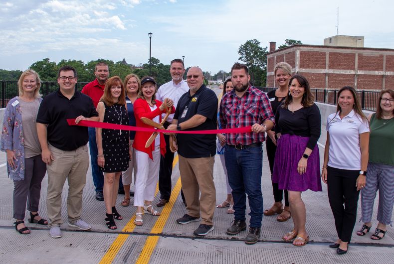 A group of ambassadors at a ribbon cutting