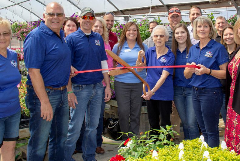 A group of ambassadors at a ribbon cutting