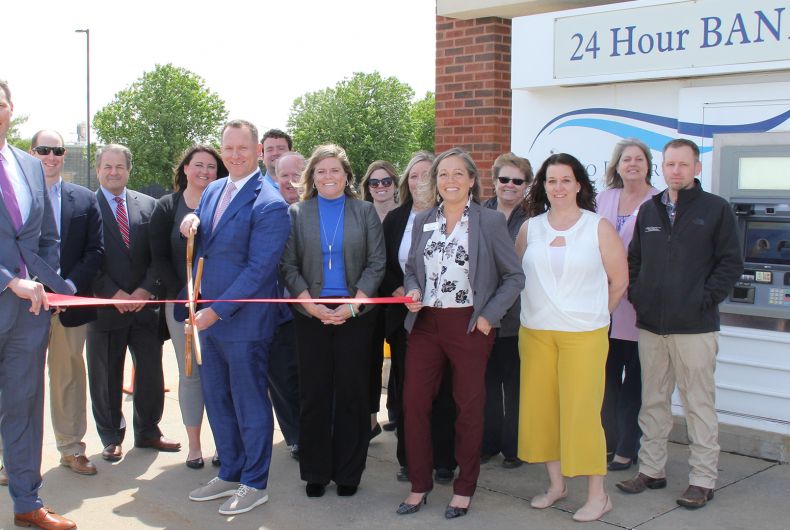 A group of ambassadors at a ribbon cutting