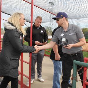 thumbnail image of A group of ambassadors at a ribbon cutting