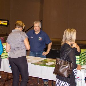 thumbnail image of People standing around a booth at the teacher's appreciation