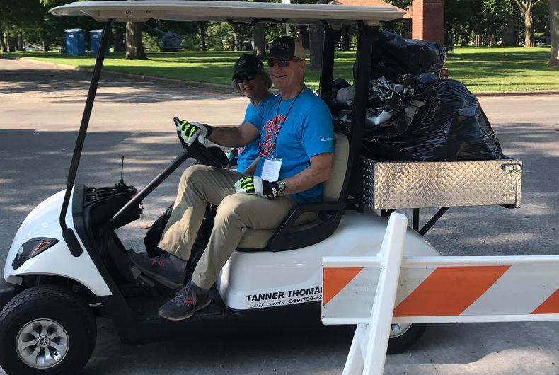 Volunteers in a golf cart