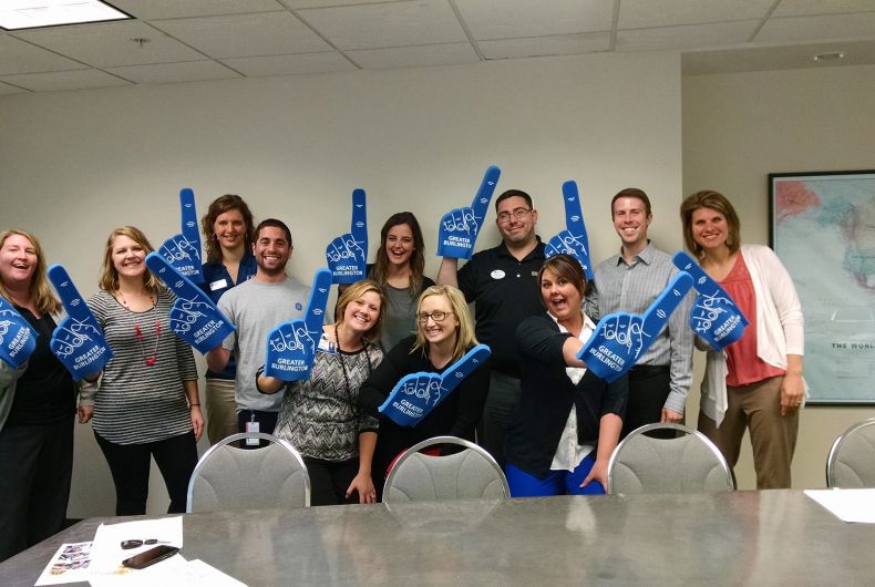 Volunteers with foam fingers